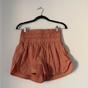 FP Movement by Free People Smocked High-Waist Athletic Shorts in Rust